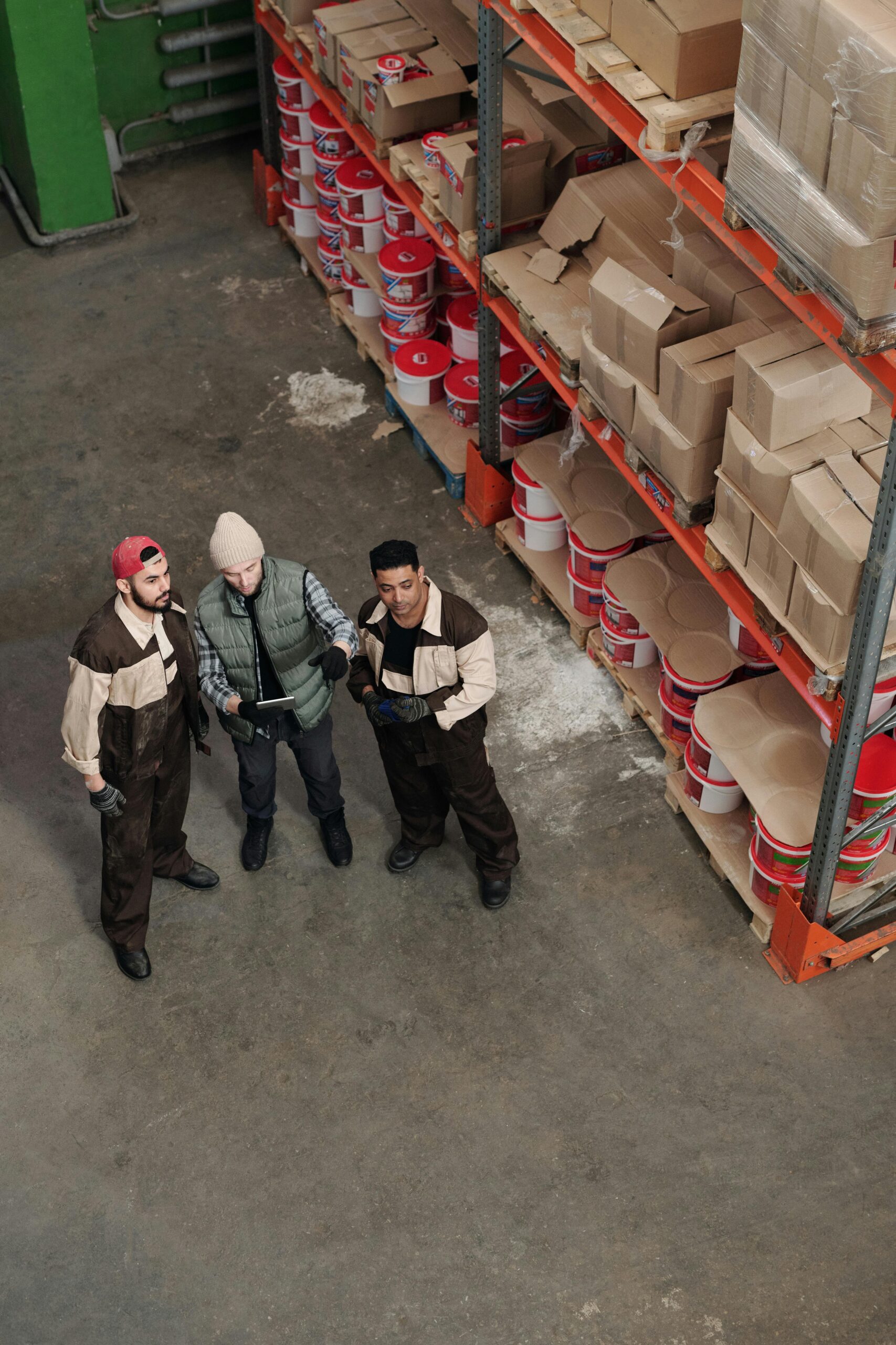ISO 9001 Internal Auditor Training - People talking in a warehouse